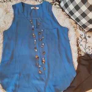 Lush Cornflower colored sleeveless blouse.